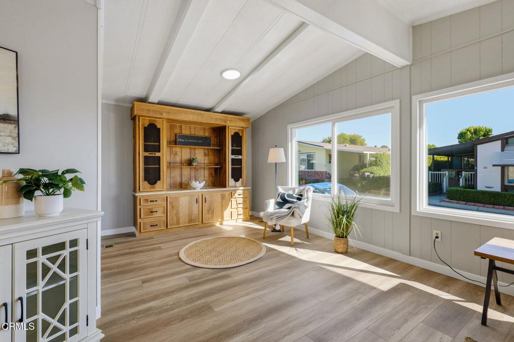 4700 Aurora Drive, Unit 16 Ventura, CA 93003 - Photo 8 of 28 a room with wooden floor table and chairs