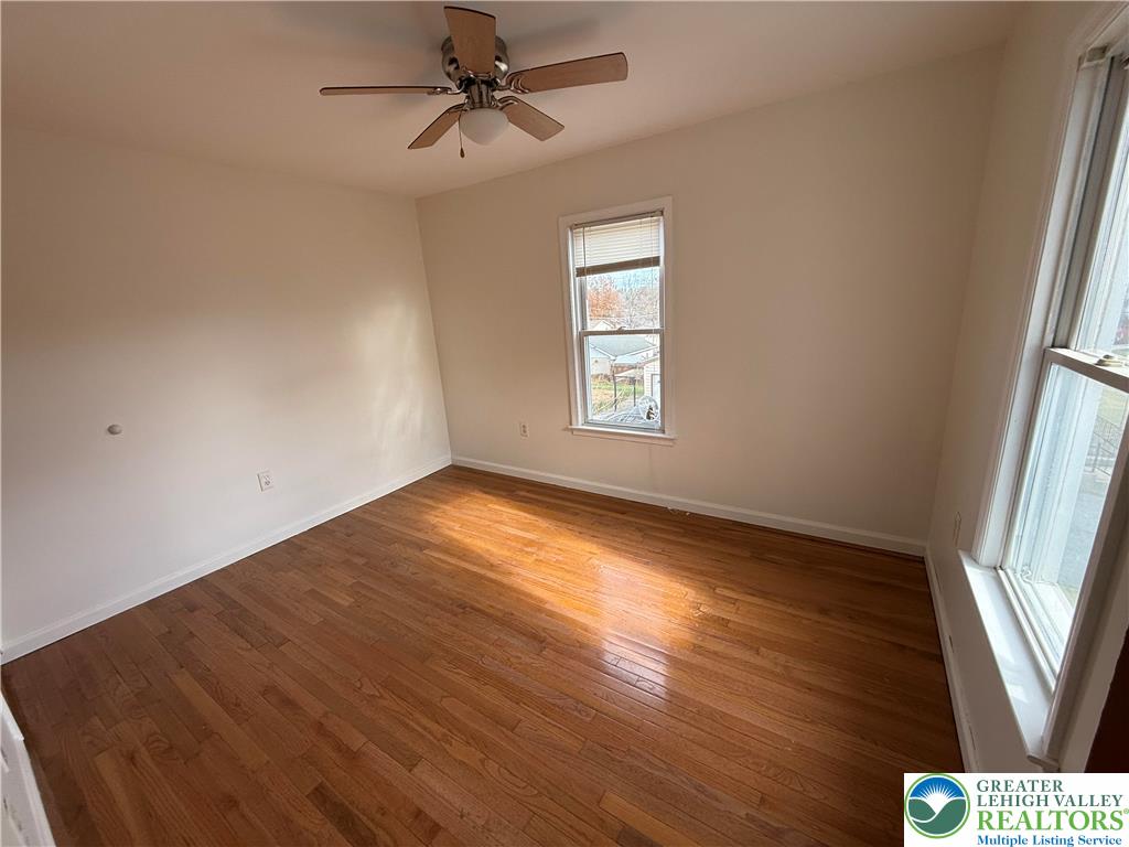 2955 Middletown Road Bethlehem, PA 18020 - Photo 16 of 20 a view of empty room with wooden floor and fan
