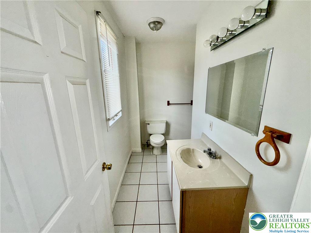 2955 Middletown Road Bethlehem, PA 18020 - Photo 6 of 20 a bathroom with a granite countertop sink a toilet and a shower