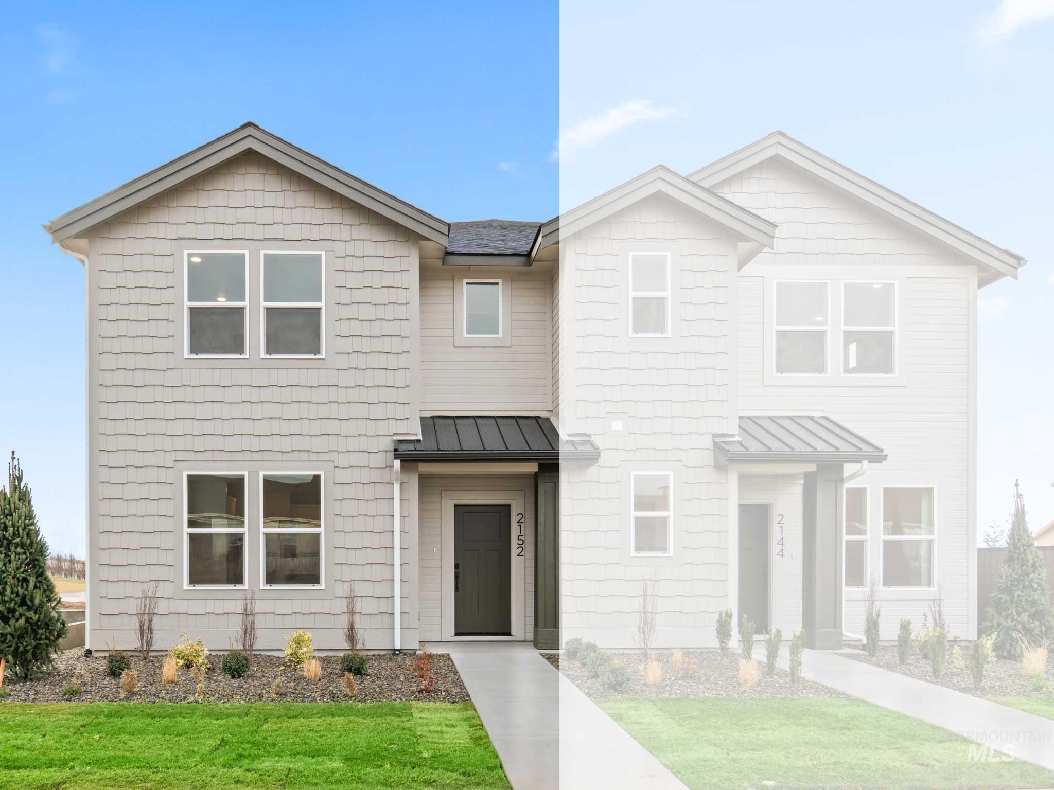 View of front of home featuring a standing seam roof, a metal roof, and a front lawn