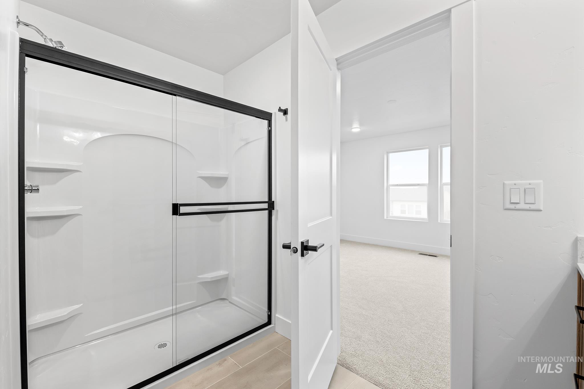 2168 East Deep Purple Lane Meridian, ID 83642 - Photo 9 of 15 Bathroom with a stall shower and vanity