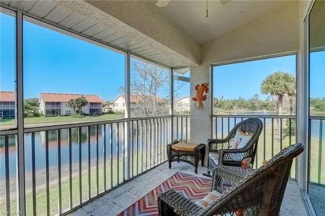 a view of a two chairs in the balcony