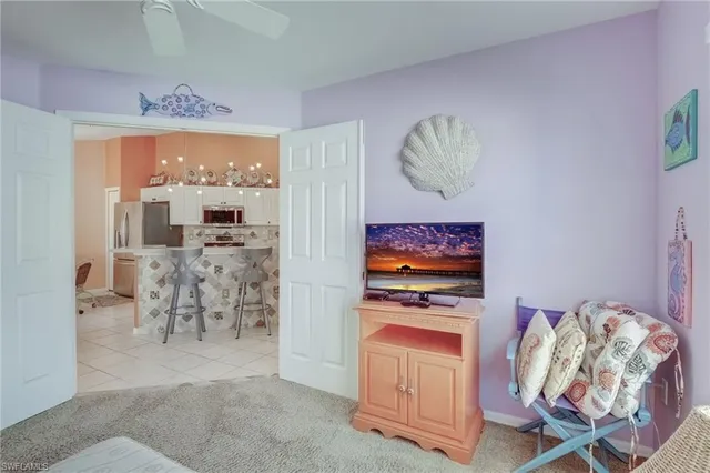 a room with furniture and a flat screen tv