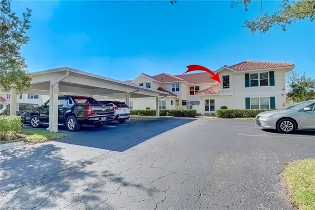 a view of a car park in front of house