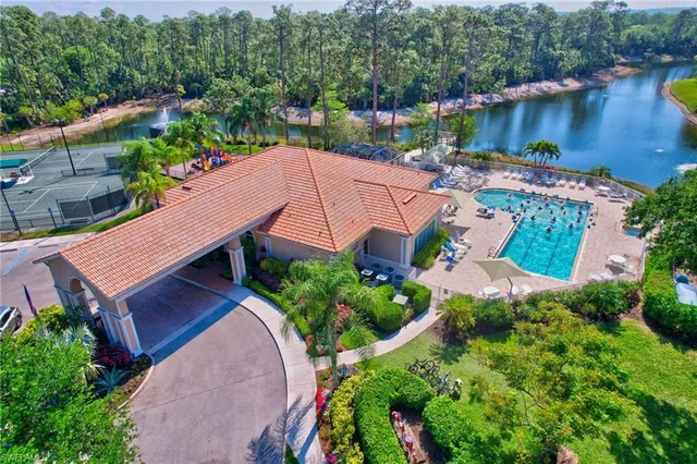 an aerial view of a house with outdoor space and lake view