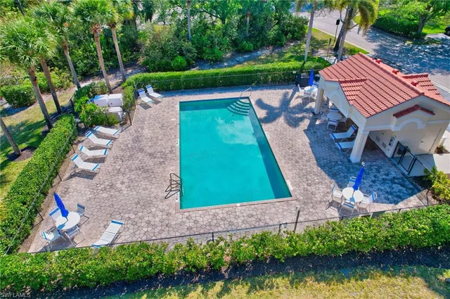 a view of a backyard with plants and a patio
