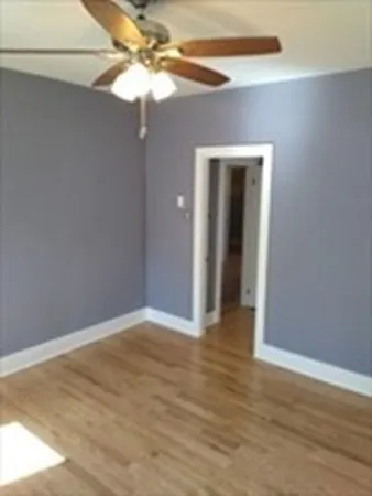 a view of an empty room with a fan