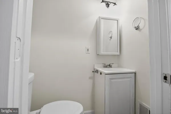 a bedroom with a bed and a table