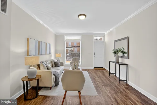 a view of dining room with furniture and wooden floor
