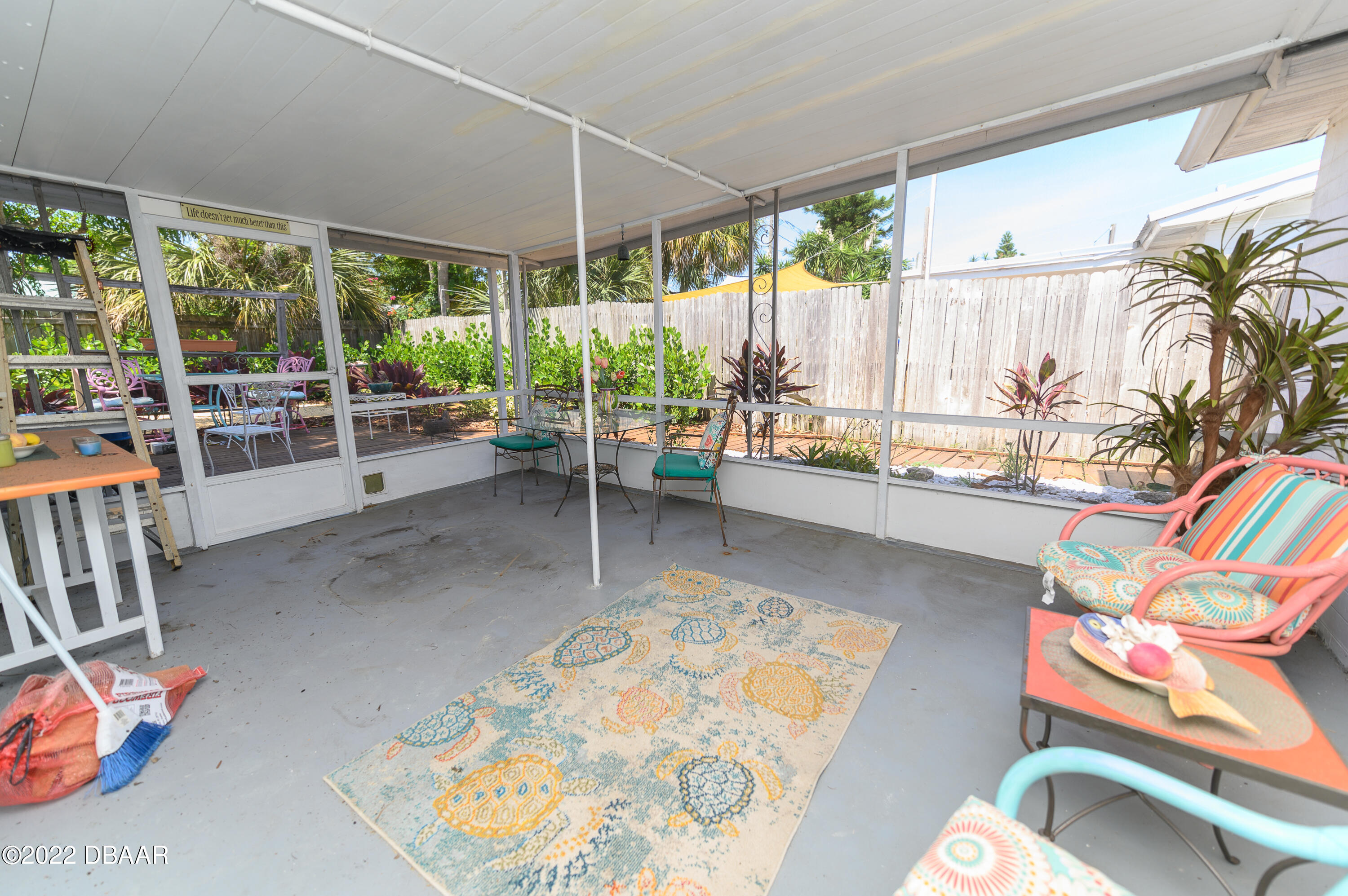 56 Margaret Road Ormond Beach, FL 32176 - Photo 11 of 32 a living room with furniture and a large window