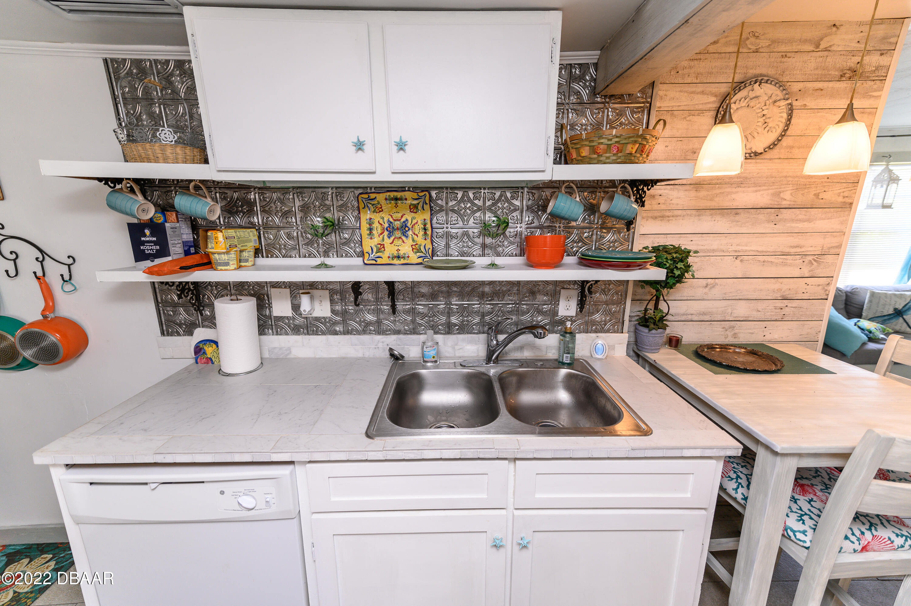 56 Margaret Road Ormond Beach, FL 32176 - Photo 14 of 32 a kitchen with a sink and a stove