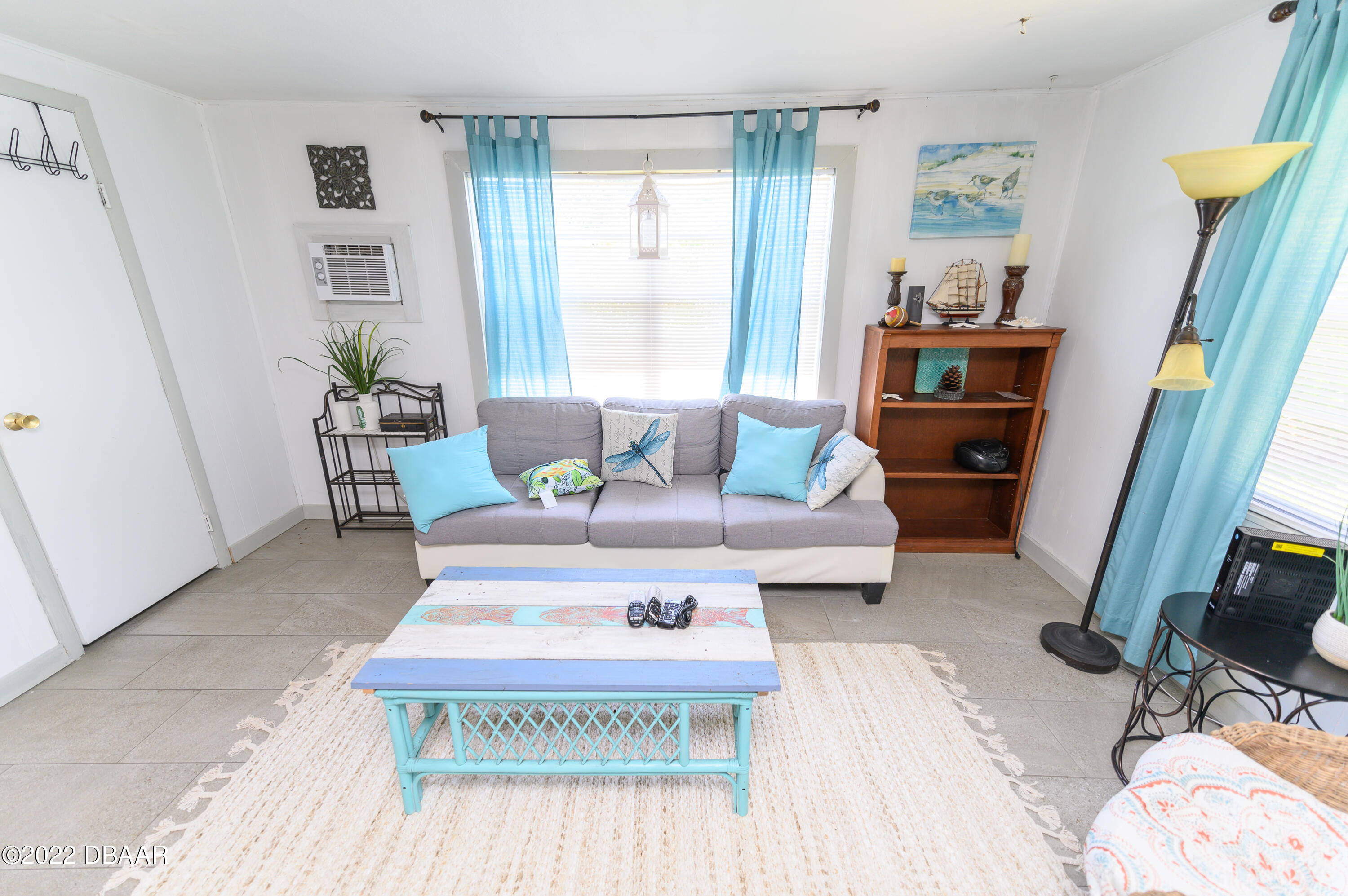 56 Margaret Road Ormond Beach, FL 32176 - Photo 16 of 32 a living room with furniture and a rug