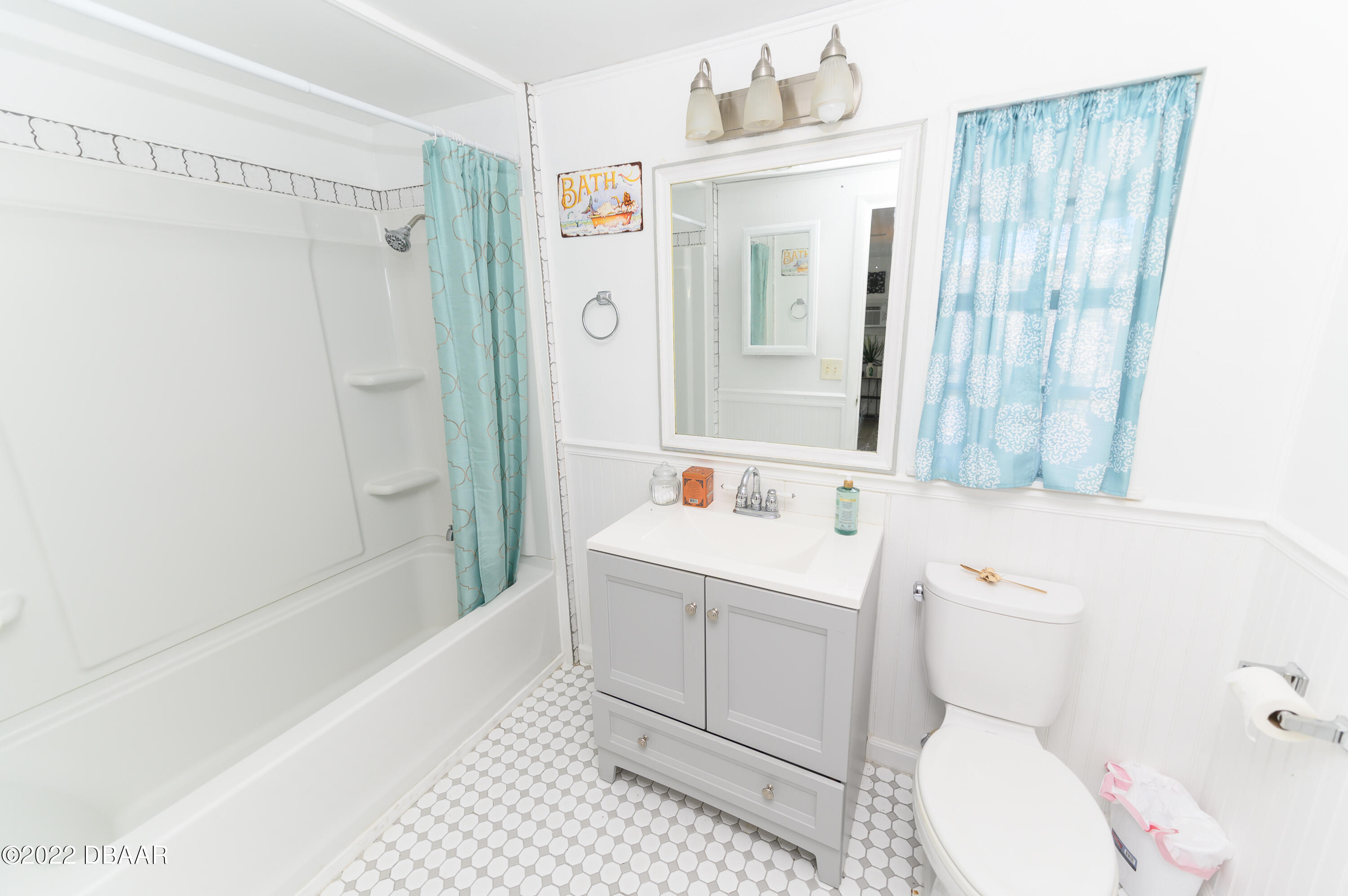 56 Margaret Road Ormond Beach, FL 32176 - Photo 17 of 32 a bathroom with a sink a toilet and shower