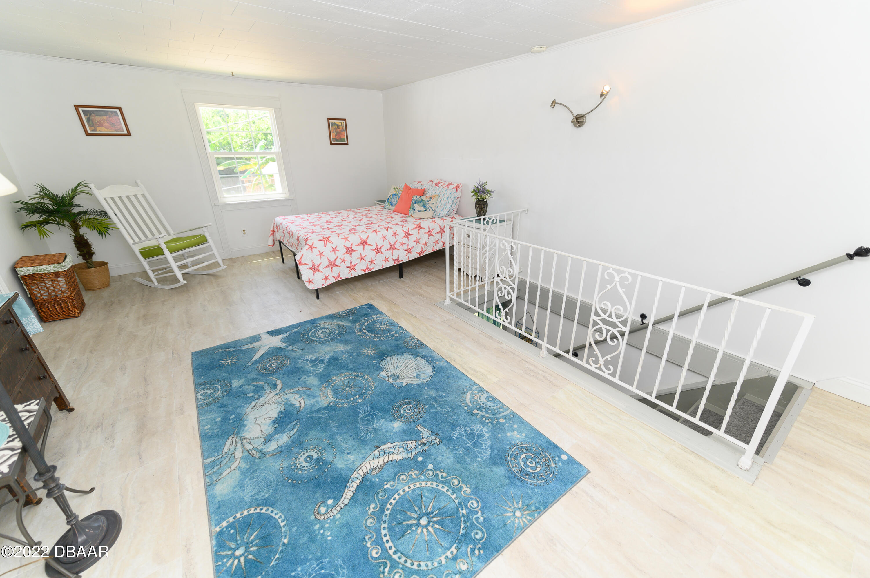 56 Margaret Road Ormond Beach, FL 32176 - Photo 18 of 32 a bedroom with furniture and a wooden floor