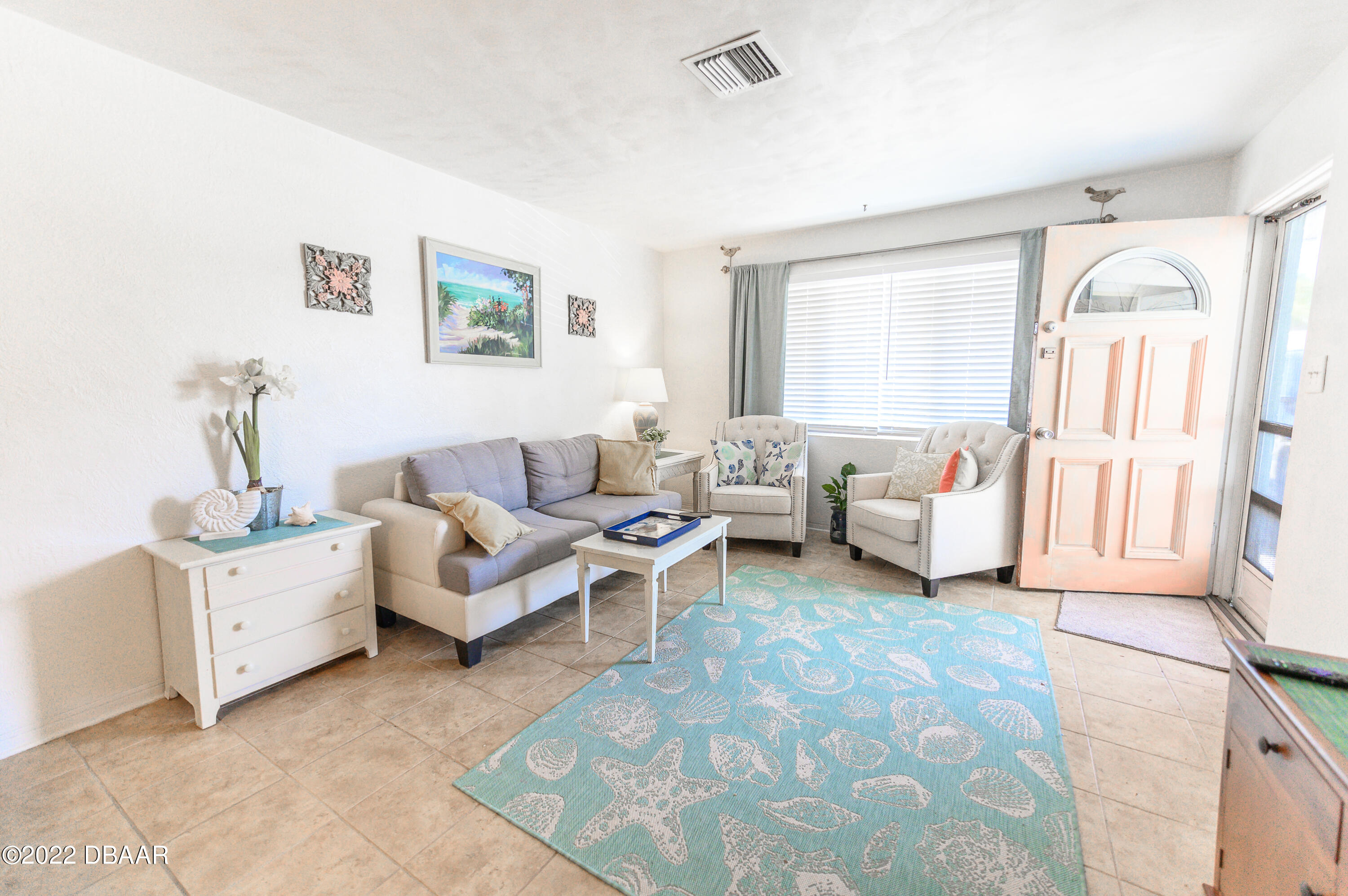 56 Margaret Road Ormond Beach, FL 32176 - Photo 20 of 32 a living room with furniture and a large window