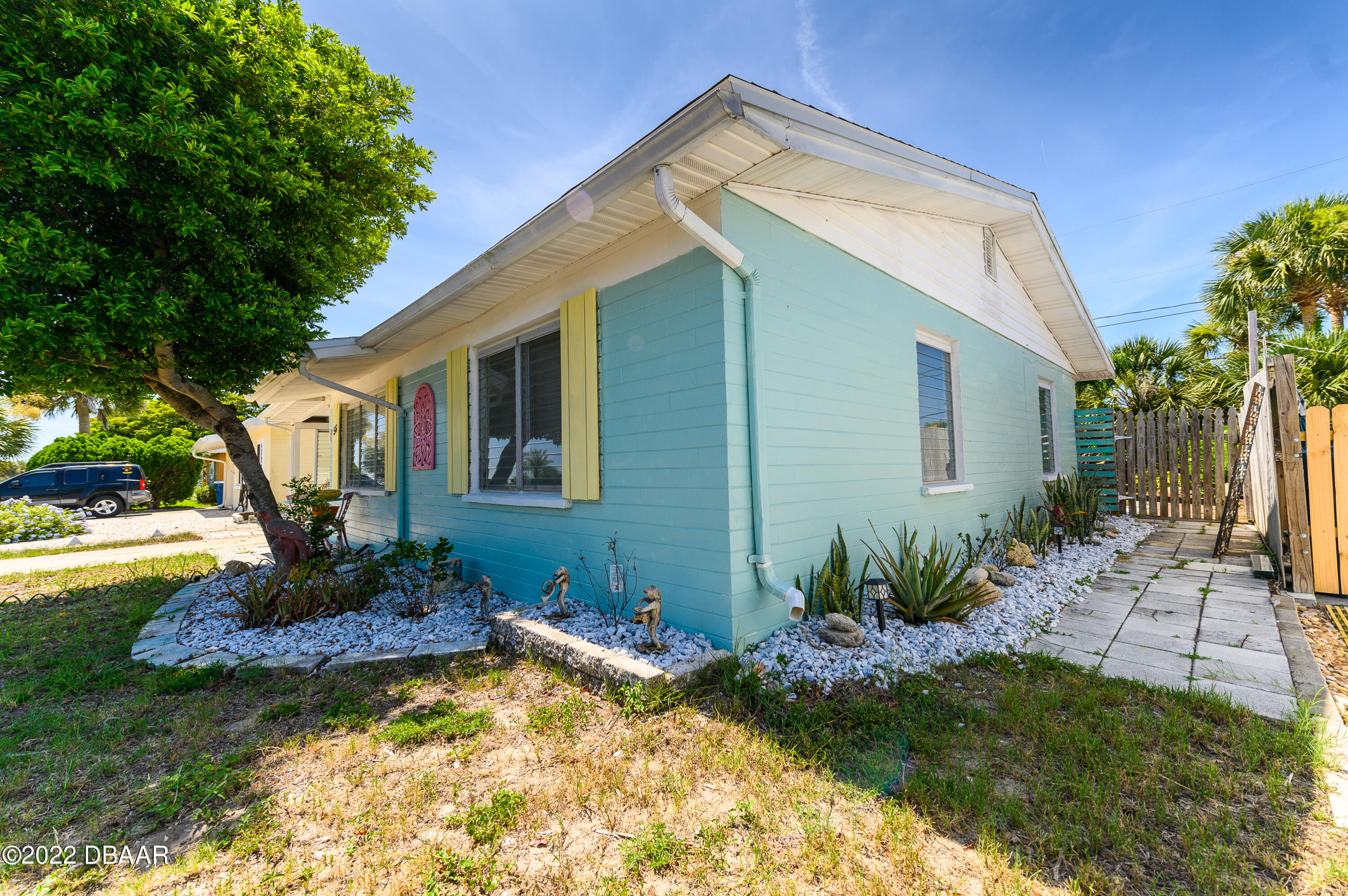 56 Margaret Road Ormond Beach, FL 32176 - Photo 2 of 32 a front view of a house with garden