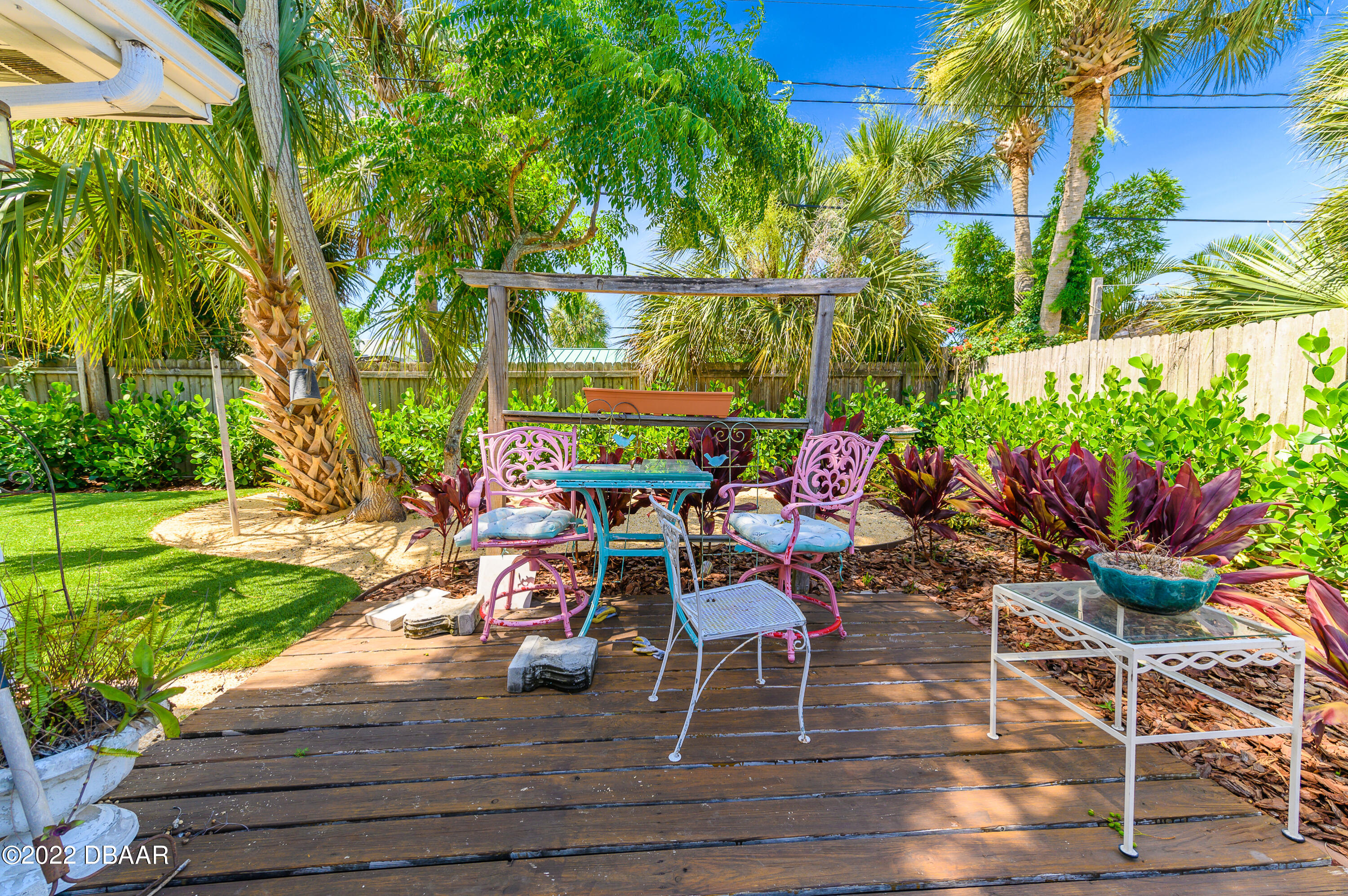 56 Margaret Road Ormond Beach, FL 32176 - Photo 27 of 32 a view of a chairs and tables in the backyard