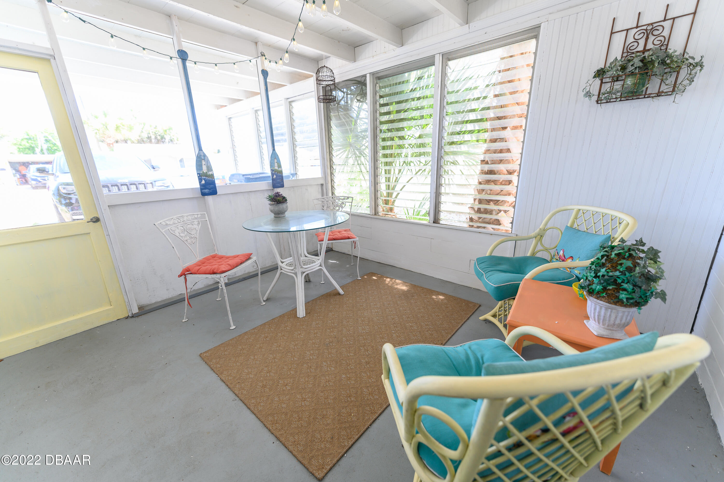 56 Margaret Road Ormond Beach, FL 32176 - Photo 4 of 32 a living room with furniture and a large window