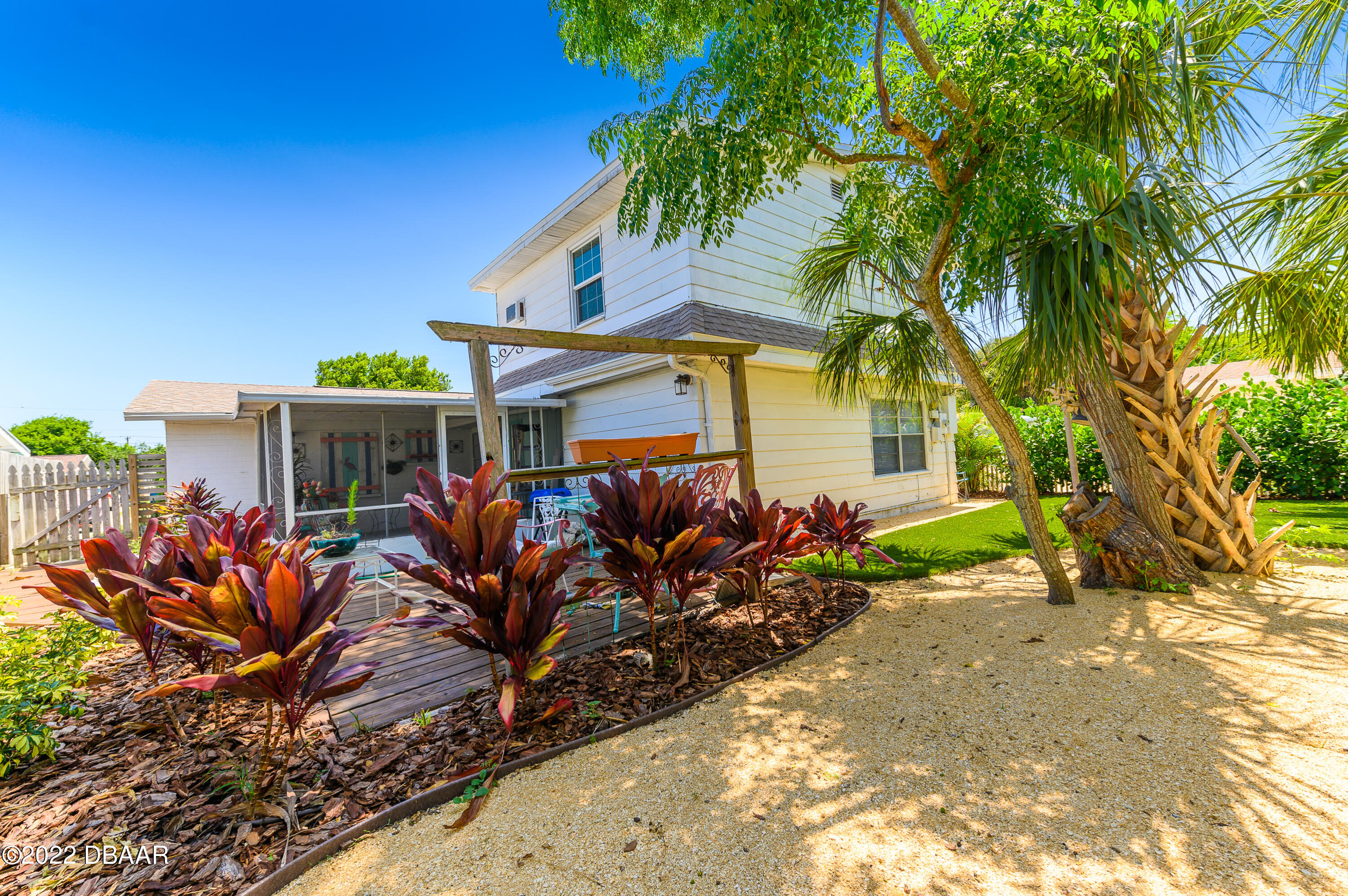 56 Margaret Road Ormond Beach, FL 32176 - Photo 5 of 32 front view of a house with a tree in front