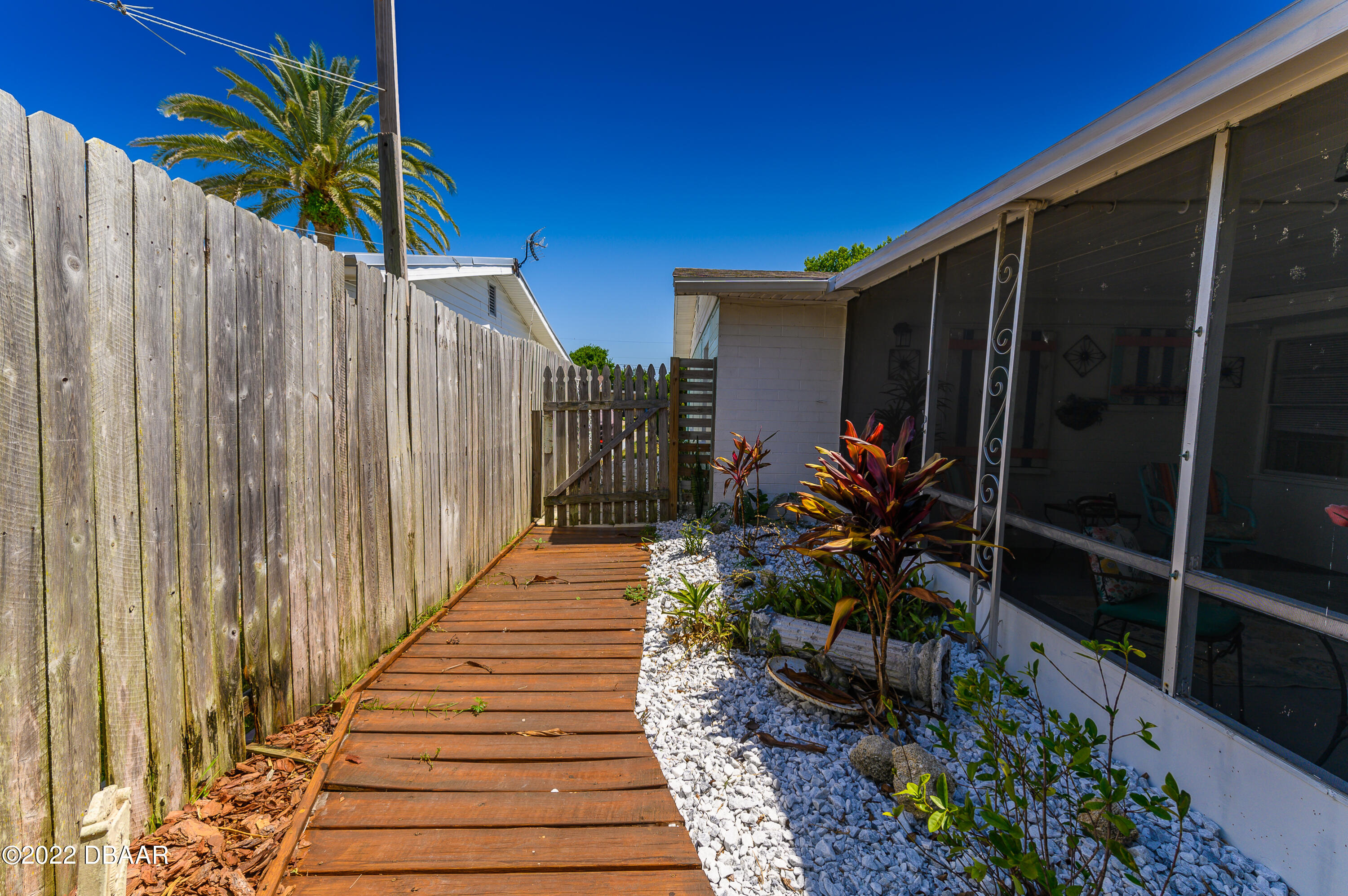 56 Margaret Road Ormond Beach, FL 32176 - Photo 6 of 32 a view of a potted plants on wooden deck