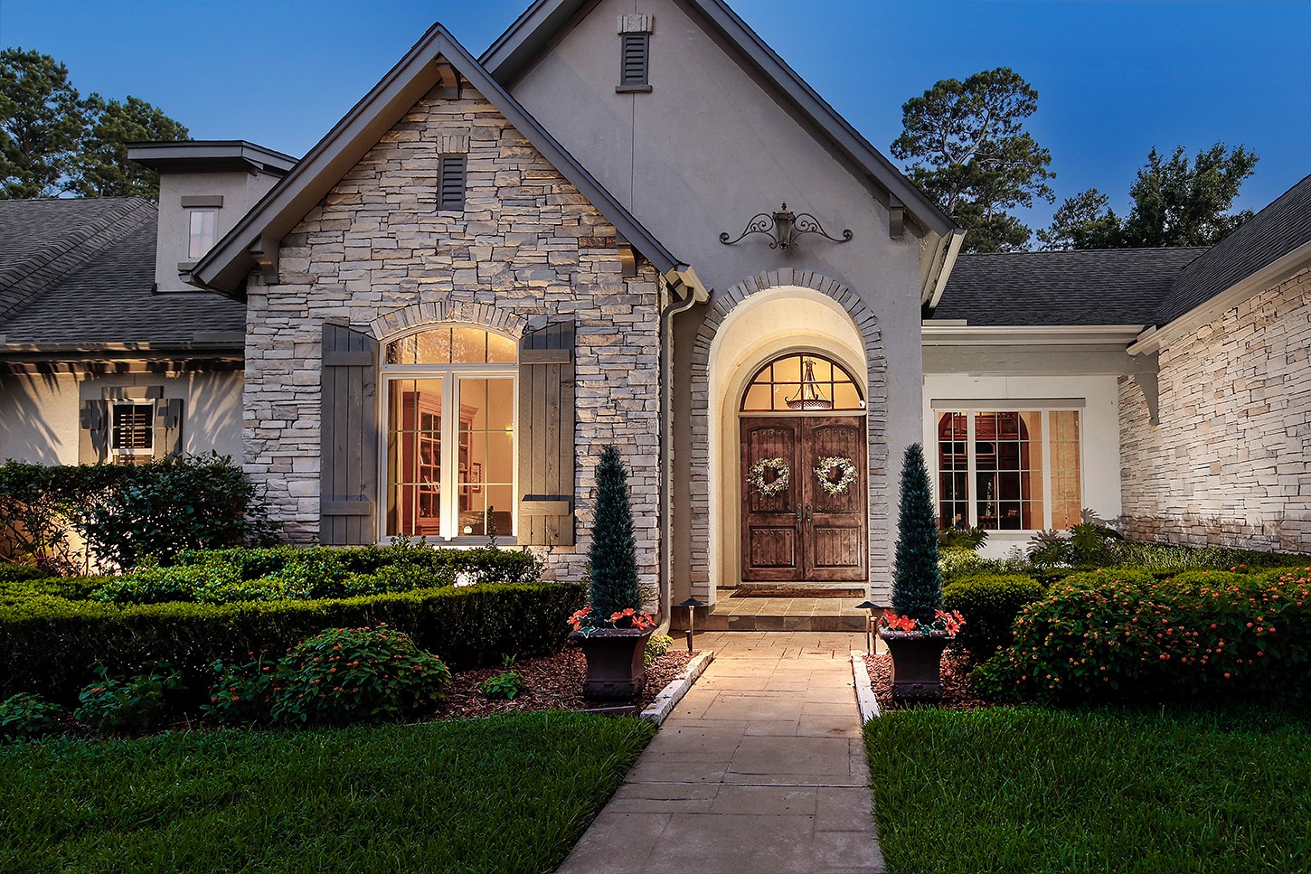 119 Angel Leaf Road The Woodlands, TX 77380 - Photo 6 of 50 a front view of a house with a garden