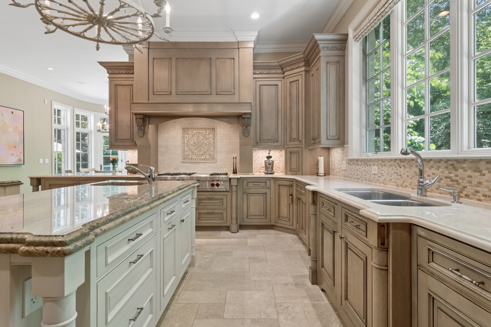 1128 Mt Pleasant Road Winnetka, IL 60093 - Photo 19 of 58 a kitchen with stainless steel appliances granite countertop a sink stove and cabinets
