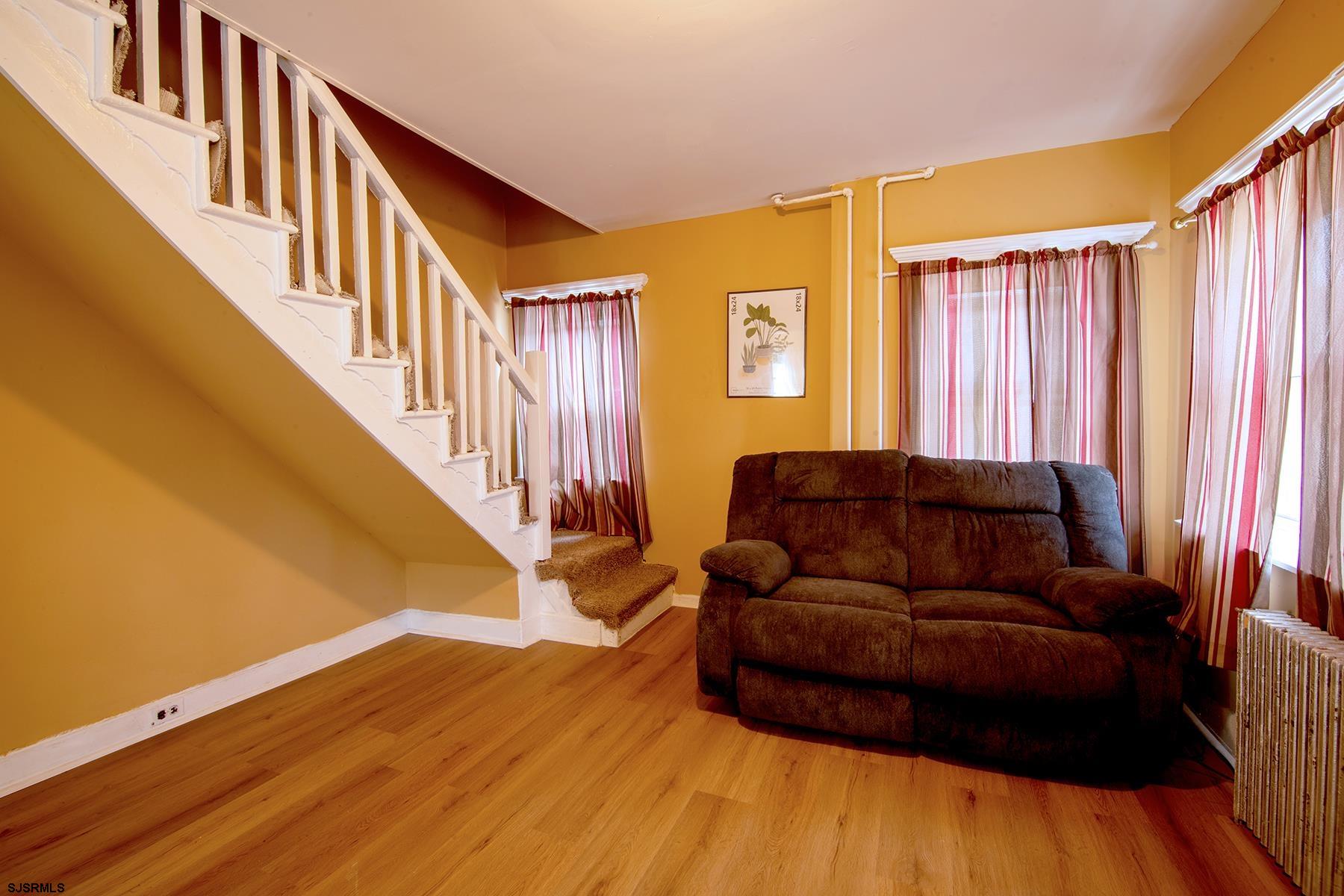 638 Wisteria Road Atlantic City, NJ 08401 - Photo 12 of 33 a living room with furniture and a wooden floor