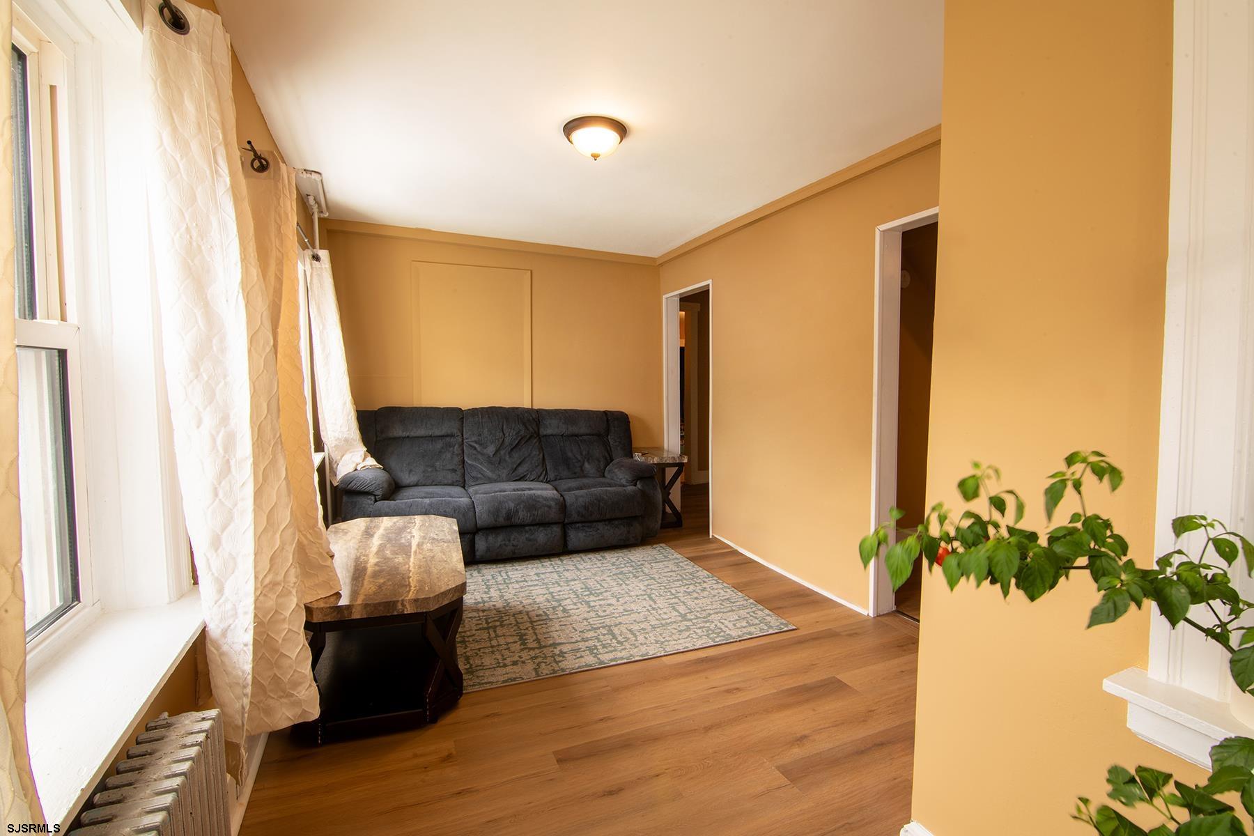638 Wisteria Road Atlantic City, NJ 08401 - Photo 14 of 33 a living room with furniture and a potted plant