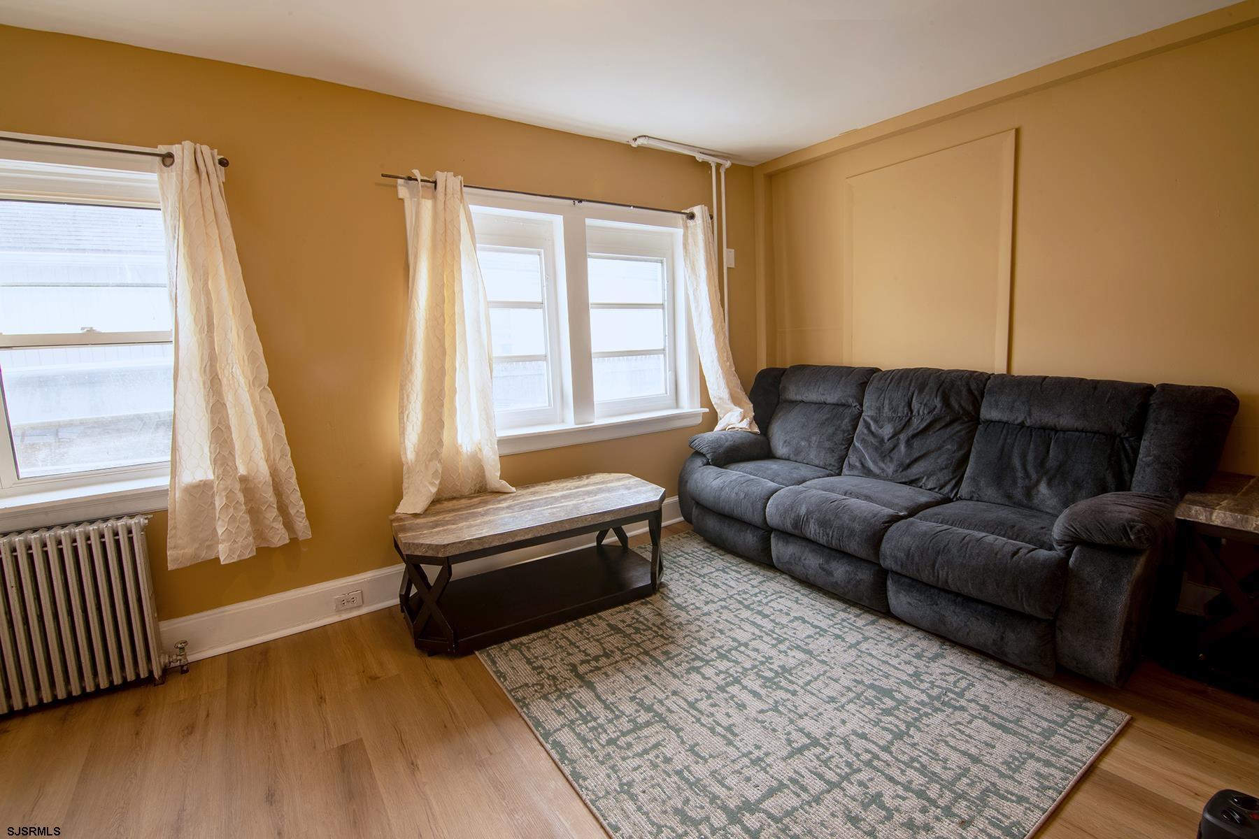 638 Wisteria Road Atlantic City, NJ 08401 - Photo 16 of 33 a living room with furniture and a flat screen tv