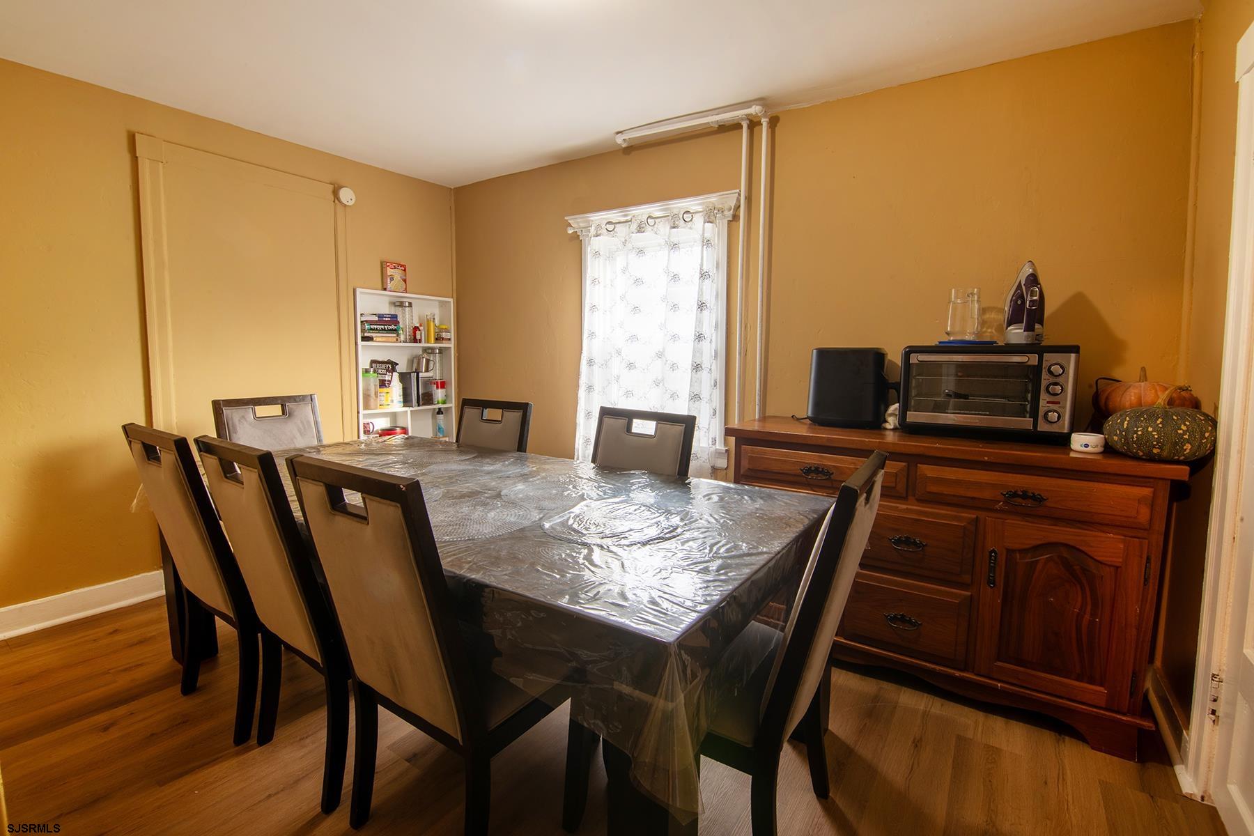 638 Wisteria Road Atlantic City, NJ 08401 - Photo 18 of 33 a view of a dining room with furniture and wooden floor