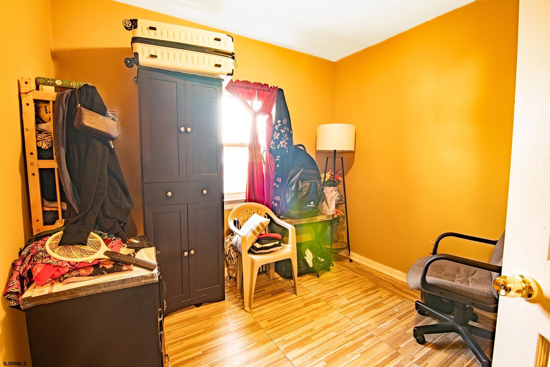 638 Wisteria Road Atlantic City, NJ 08401 - Photo 24 of 33 a view of a bedroom with wooden floor and bathroom