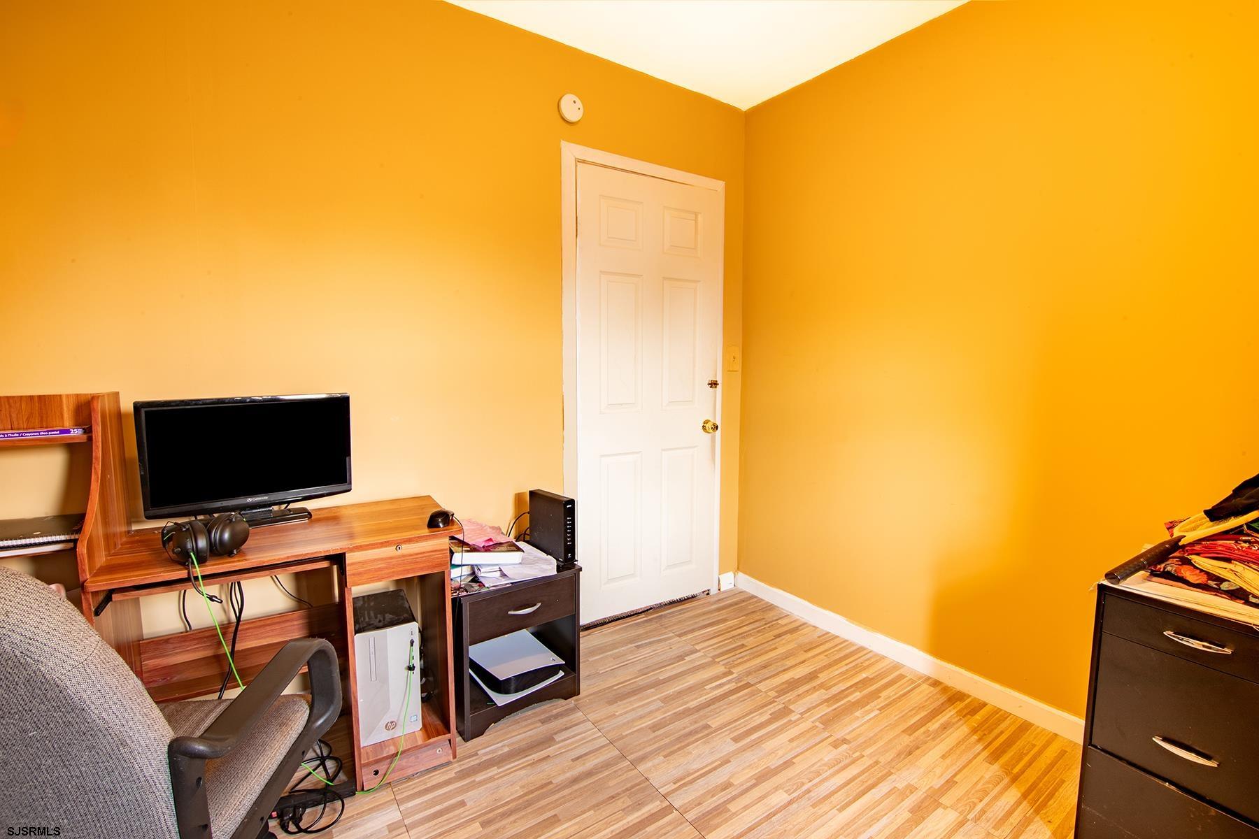 638 Wisteria Road Atlantic City, NJ 08401 - Photo 25 of 33 a view of a workspace with furniture and wooden floor
