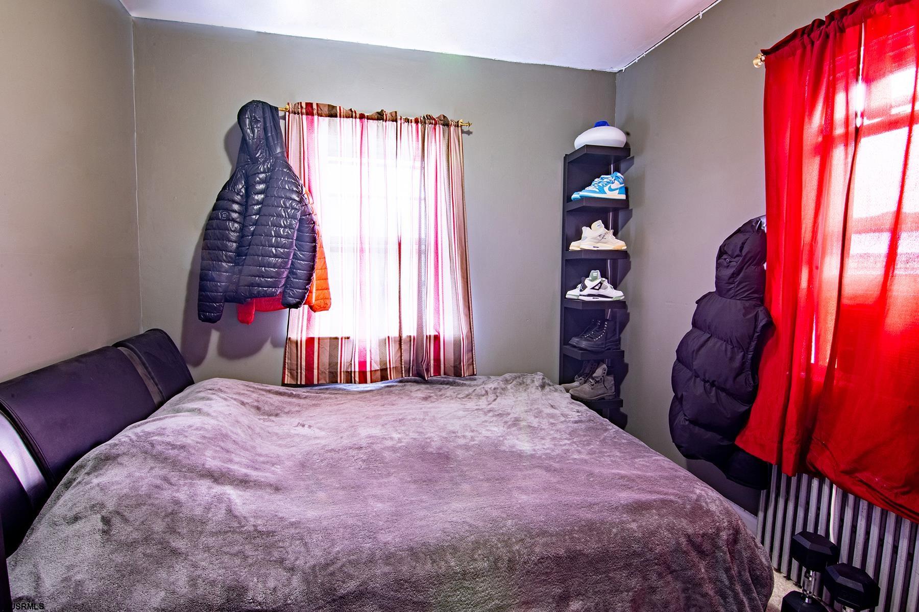 638 Wisteria Road Atlantic City, NJ 08401 - Photo 32 of 33 a bedroom with a bed and a window