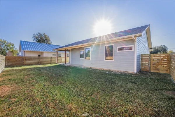 a view of a backyard of the house