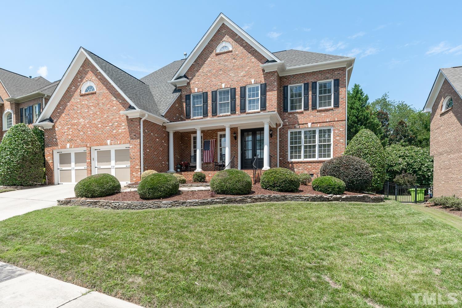 2001 Lowery Farm Lane Raleigh, NC 27614 - Photo 1 of 33 a front view of a house with a yard and potted plants