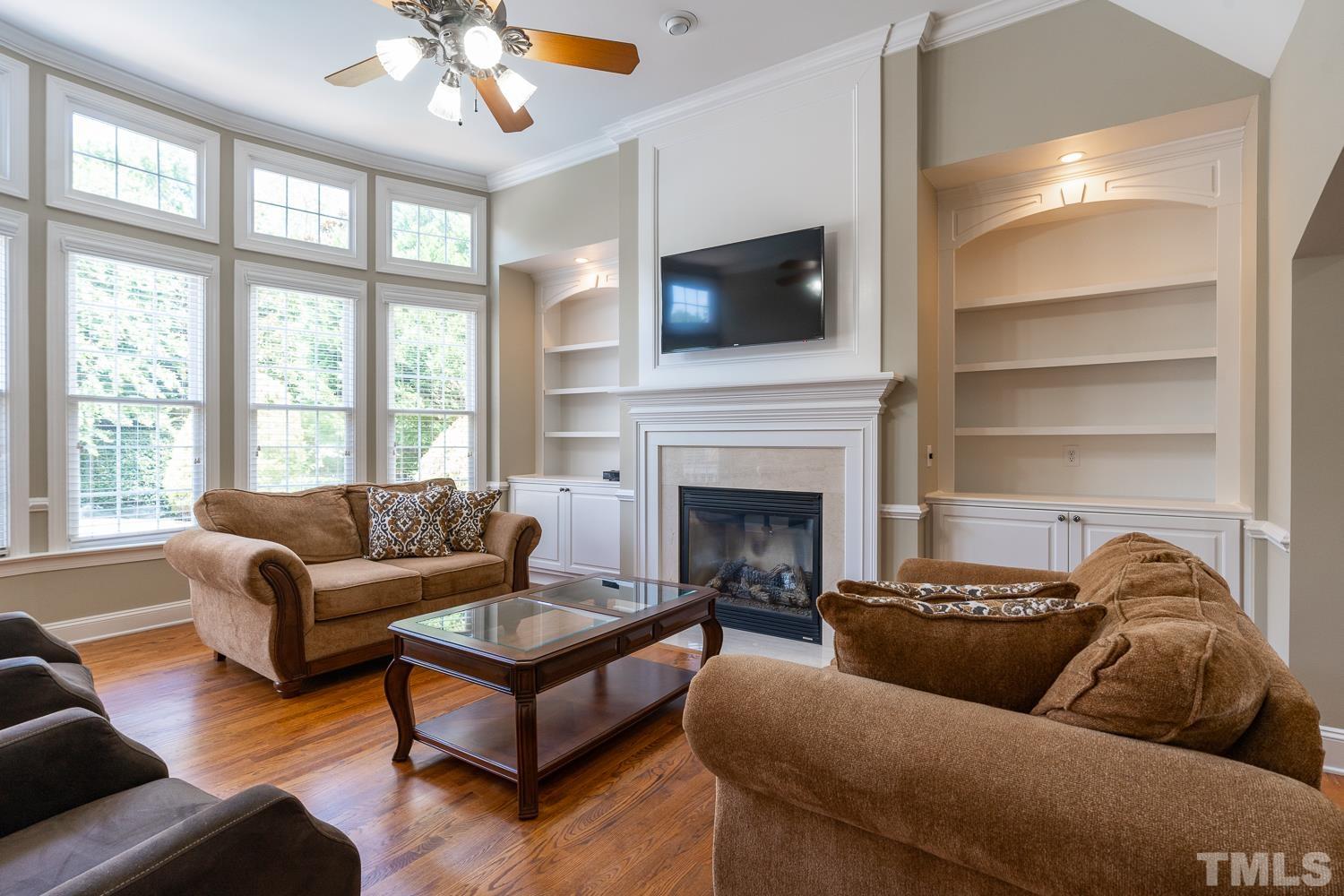 2001 Lowery Farm Lane Raleigh, NC 27614 - Photo 13 of 33 a living room with furniture or outdoor view and a fireplace