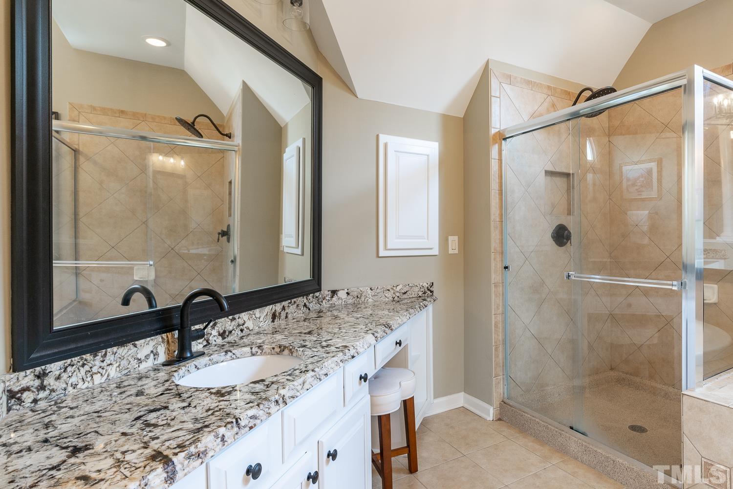 2001 Lowery Farm Lane Raleigh, NC 27614 - Photo 22 of 33 a bathroom with a granite countertop sink mirror and shower