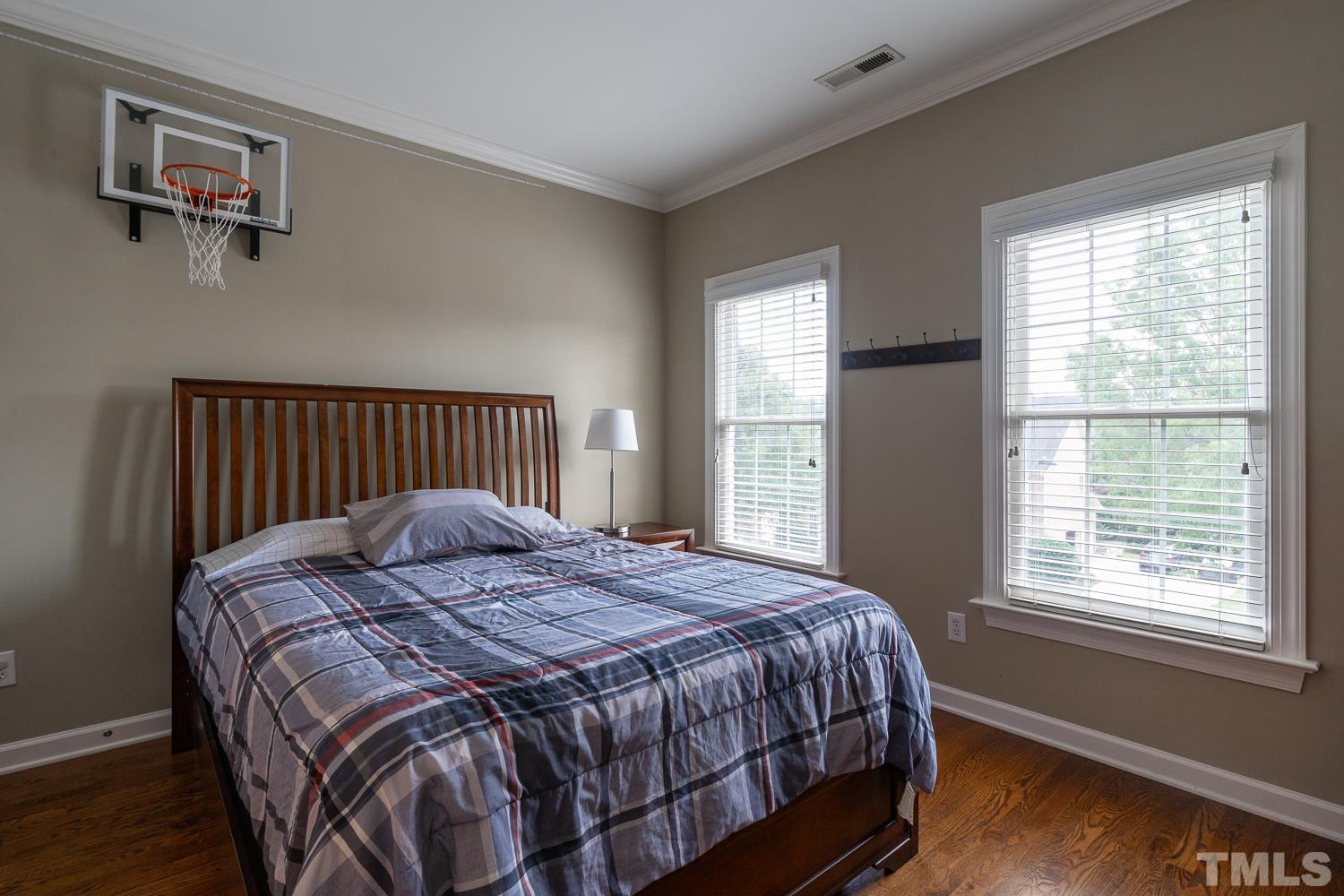 2001 Lowery Farm Lane Raleigh, NC 27614 - Photo 24 of 33 a large bed sitting in a bedroom next to a window
