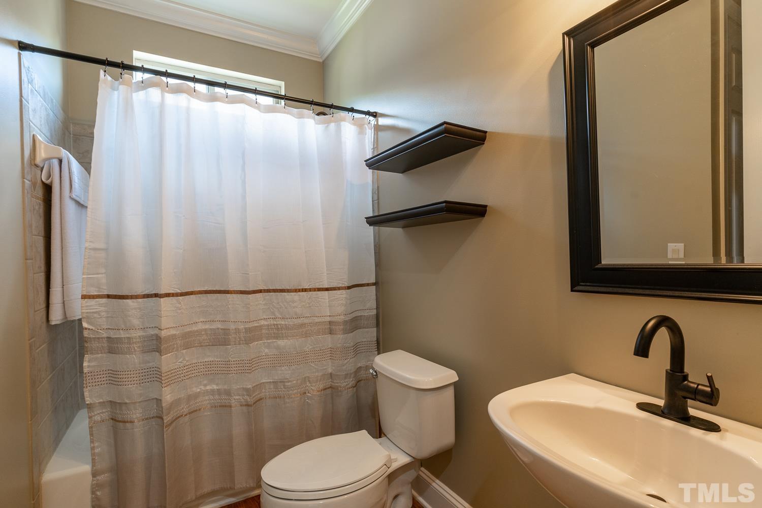 2001 Lowery Farm Lane Raleigh, NC 27614 - Photo 25 of 33 a bathroom with a sink a toilet and shower