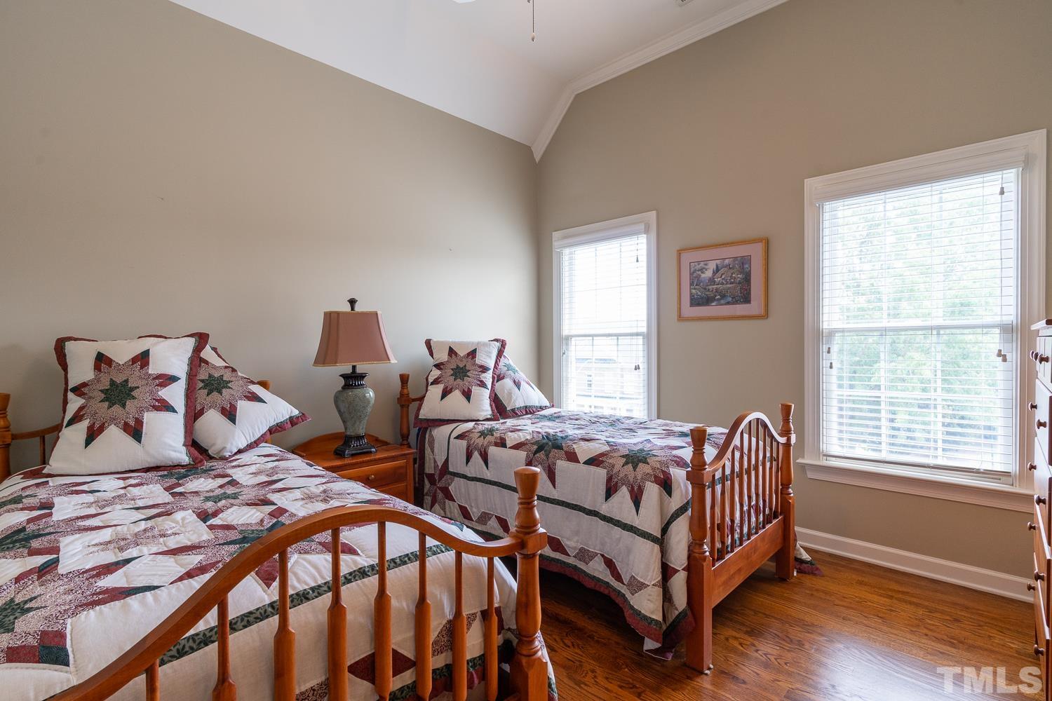 2001 Lowery Farm Lane Raleigh, NC 27614 - Photo 26 of 33 a bedroom with two beds and wooden floor