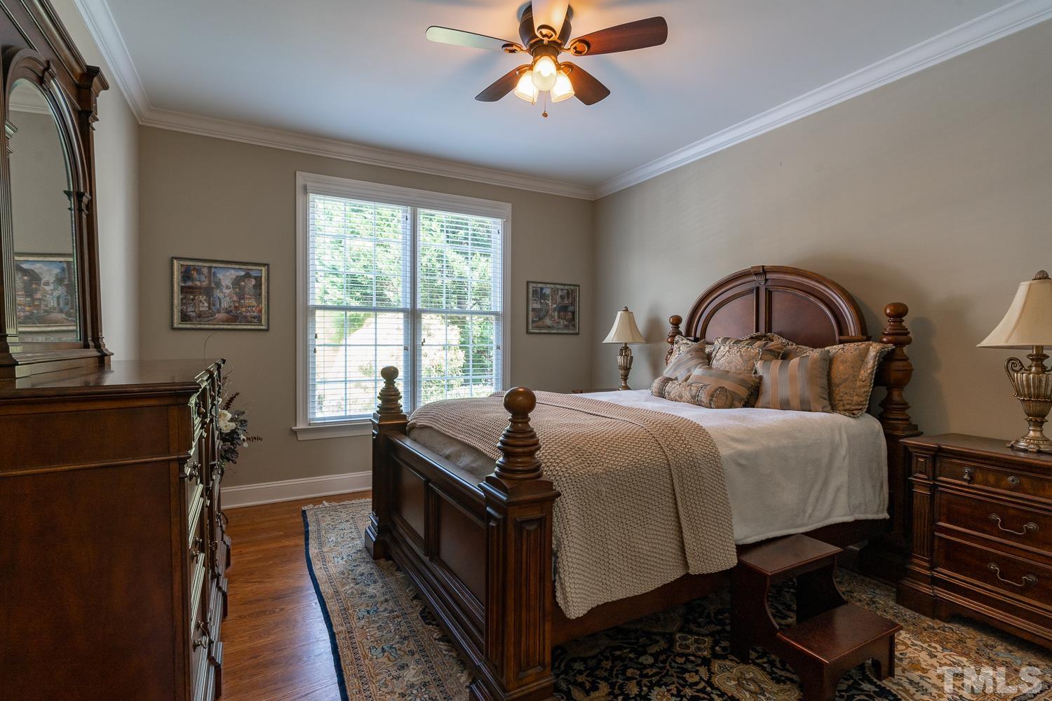 2001 Lowery Farm Lane Raleigh, NC 27614 - Photo 28 of 33 a bedroom with a bed and wooden floor