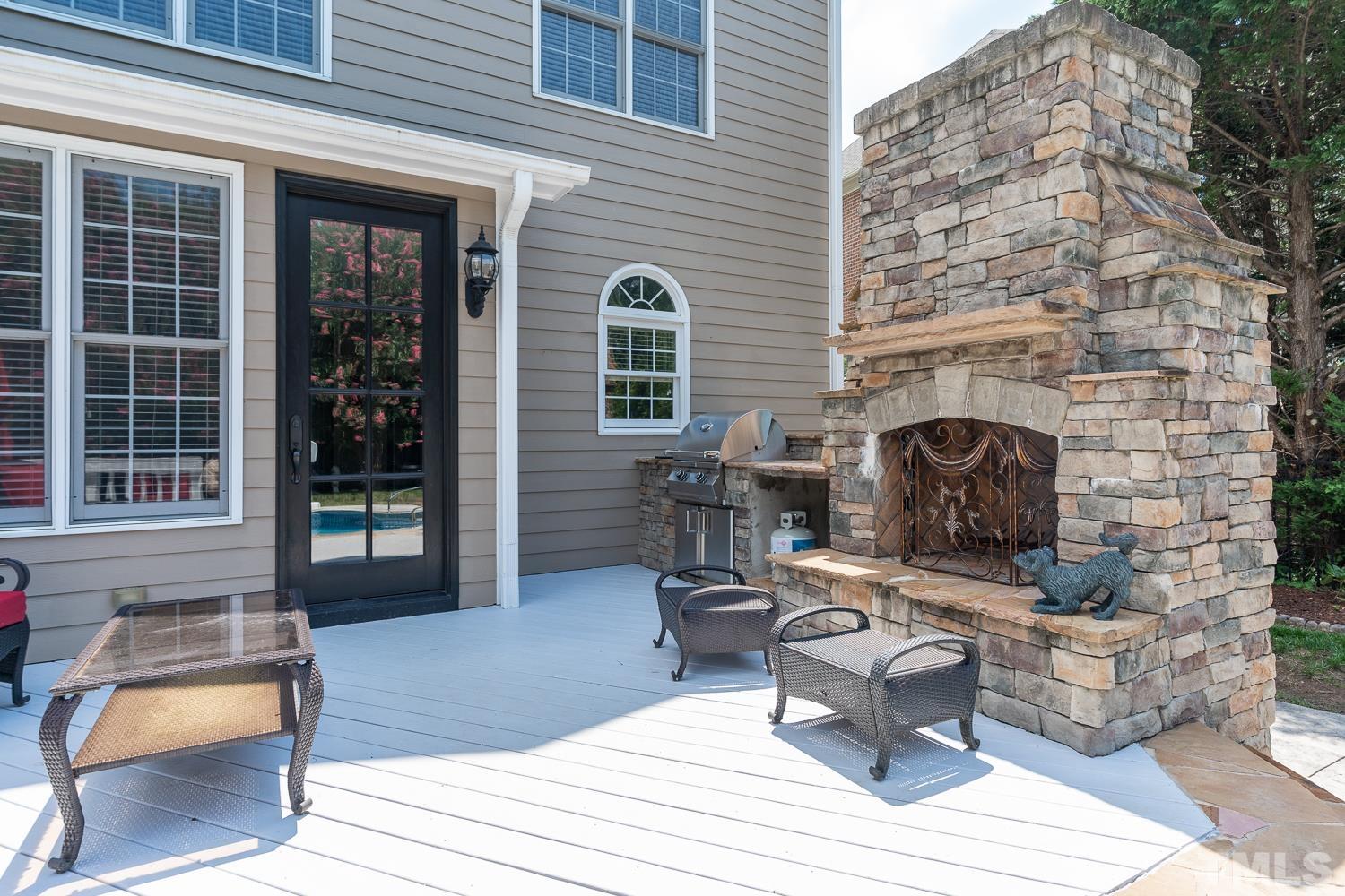 2001 Lowery Farm Lane Raleigh, NC 27614 - Photo 30 of 33 a view of a patio with table and chairs and potted plants