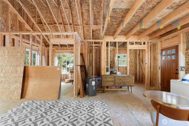 a living room with furniture and a table