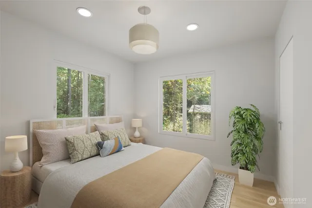 a bedroom with bed and a window