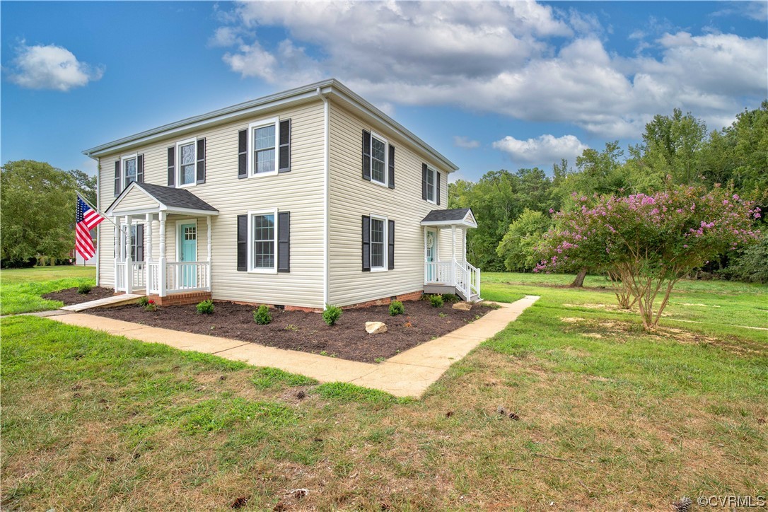 11611 Beach Road Chesterfield, VA 23838 - Photo 2 of 34 a view of a yard in front of a house with large windows
