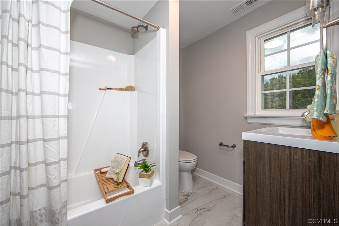 11611 Beach Road Chesterfield, VA 23838 - Photo 23 of 34 a bathroom with a sink toilet and shower