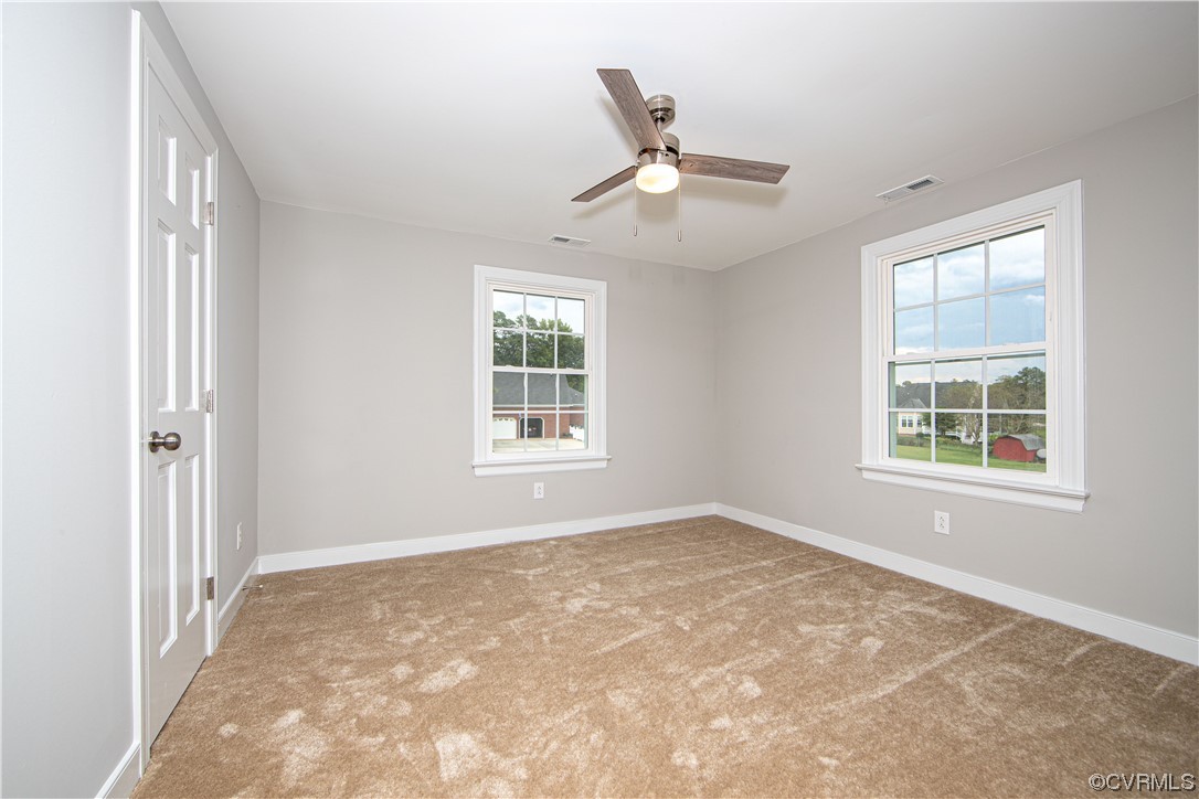 11611 Beach Road Chesterfield, VA 23838 - Photo 25 of 34 an empty room with windows and fan