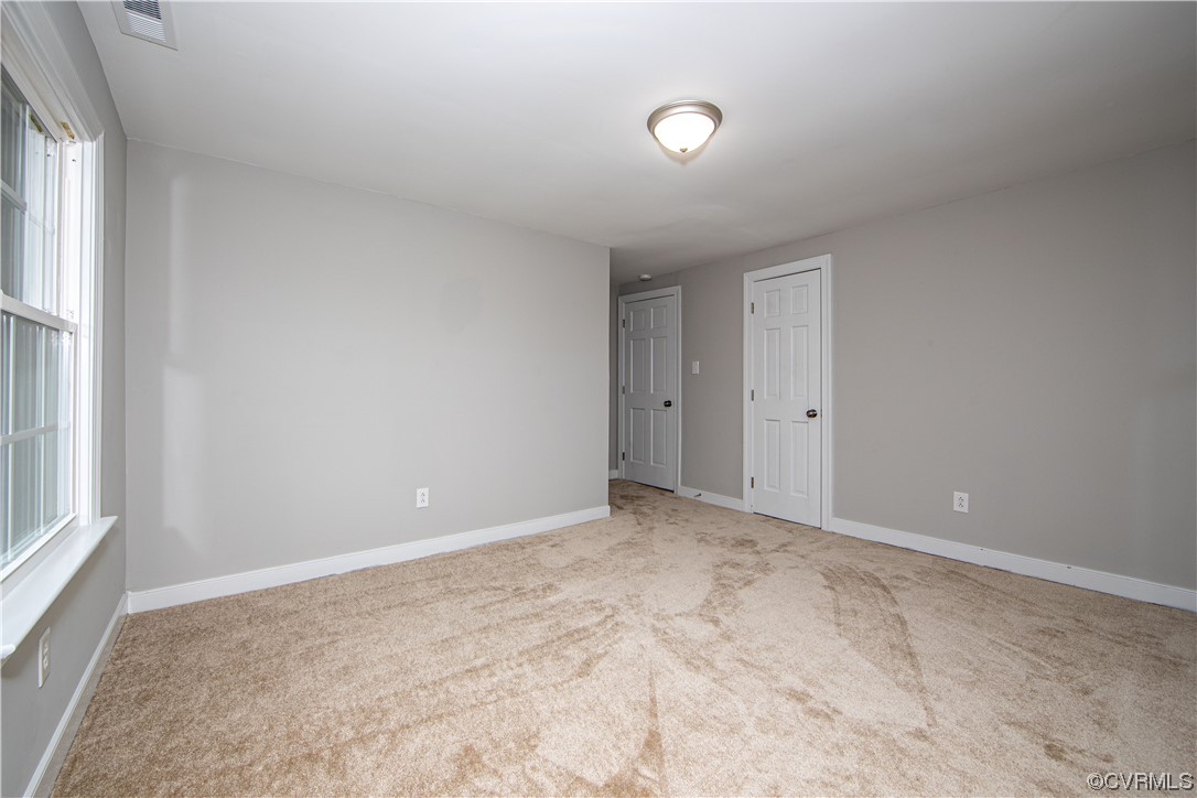 11611 Beach Road Chesterfield, VA 23838 - Photo 28 of 34 an empty room with windows and closet
