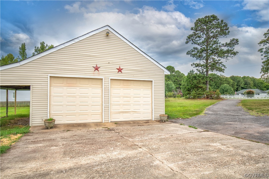 11611 Beach Road Chesterfield, VA 23838 - Photo 32 of 34 a view of a house with a yard and garage