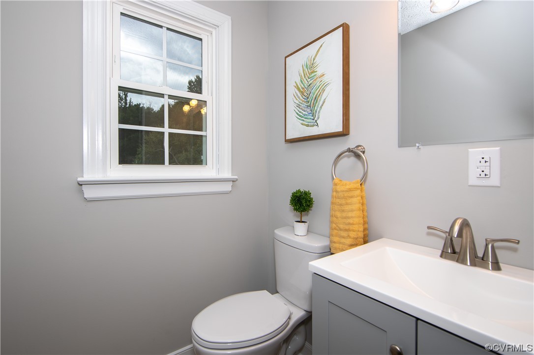 11611 Beach Road Chesterfield, VA 23838 - Photo 9 of 34 a bathroom with a toilet a sink and a window